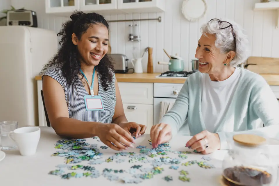 Two people assembling a puzzle together.